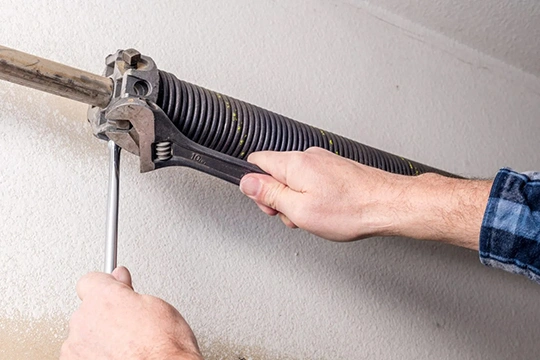 Garage Torsion Springs Installation in Roswell 1 Expert installation of garage torsion springs to restore proper function and extend door lifespan.